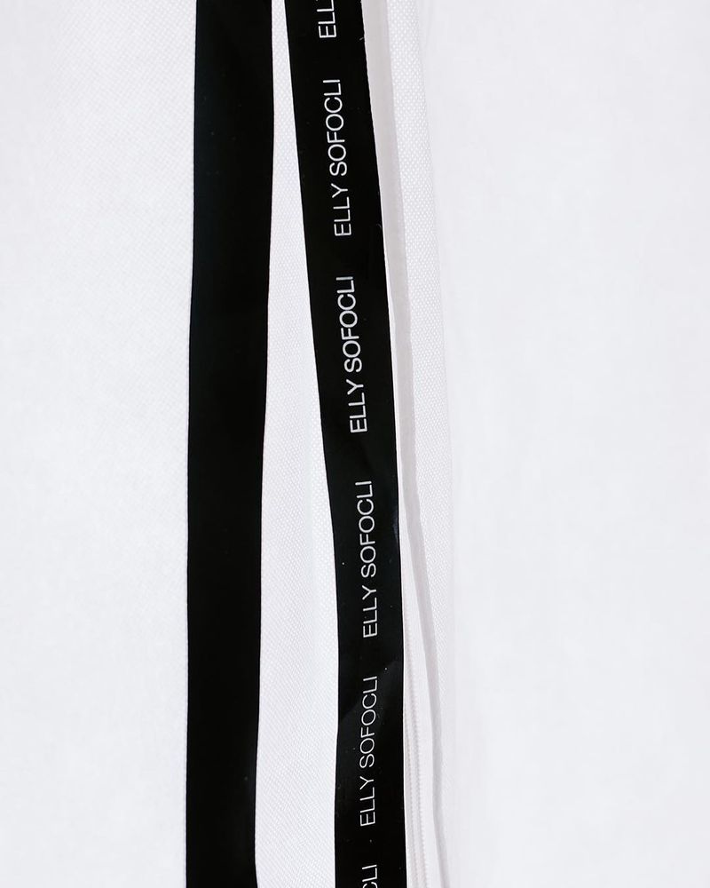 Black garment bag ribbon printed with the Elly Sofoclí name