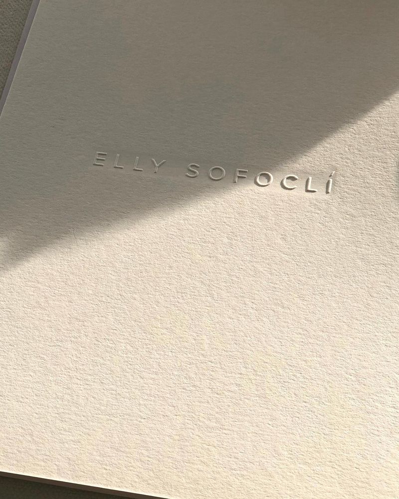 The Elly Sofoclí wordmark embossed on textured stationery