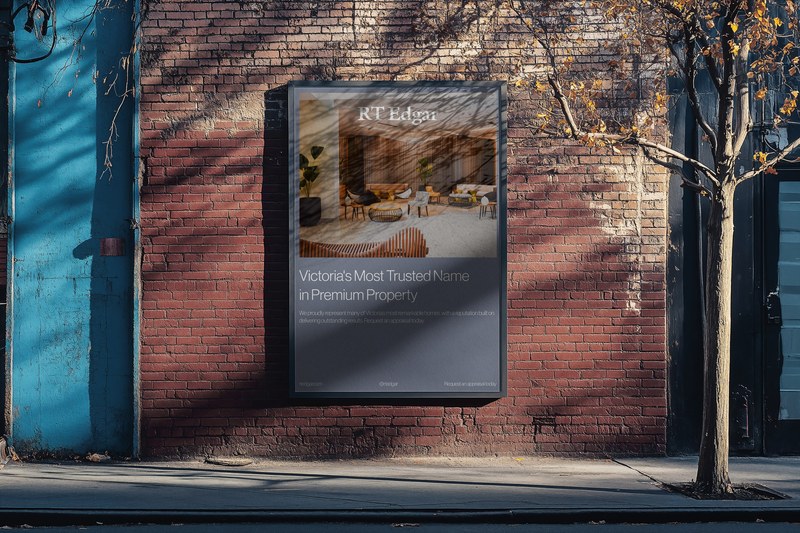 An RT Edgar campaign board on a red brick wall in a Melbourne street