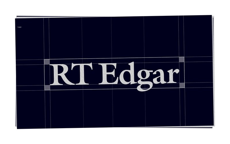 Construction grid for the RT Edgar wordmark on navy