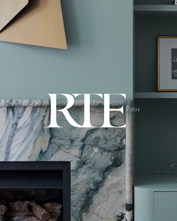 The refreshed RTE monogram, with Est 1894, over an interior with a marble fireplace
